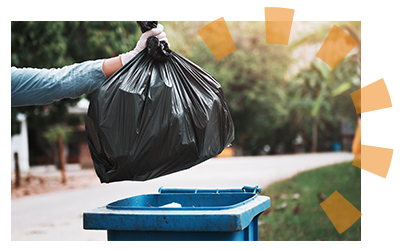 A person throwing out trash from cleaning out a storage unit 